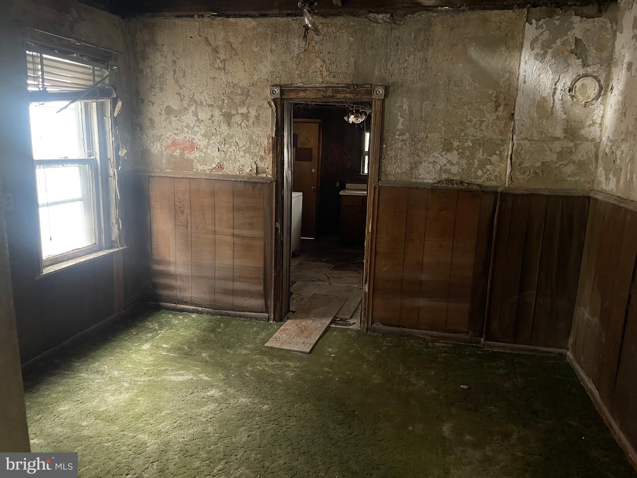 708 Jeffrey Street Chester, PA 19013 - Photo 5 of 13 an empty room with windows
