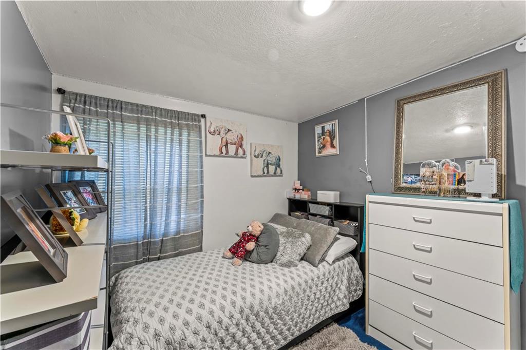338 Festival Road Washington, PA 15301 - Photo 12 of 18 a bedroom with a bed and a dresser