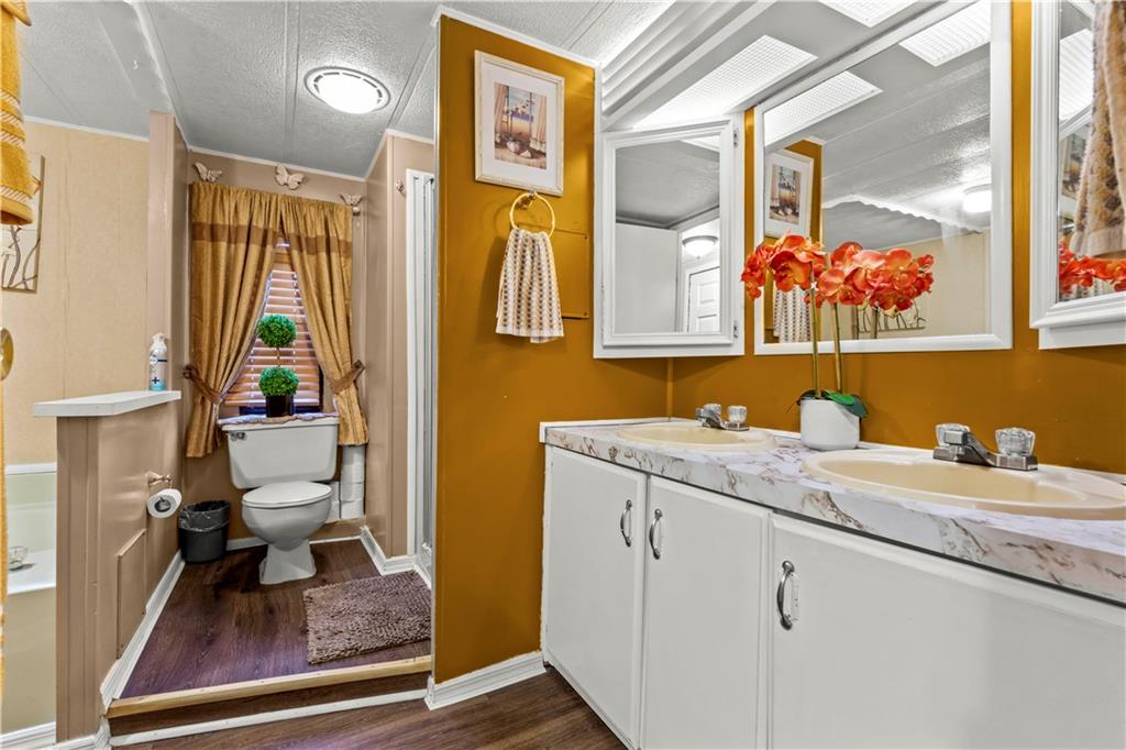 338 Festival Road Washington, PA 15301 - Photo 15 of 18 a bathroom with a granite countertop sink mirror and a toilet