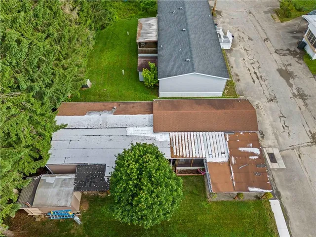 an aerial view of a house having yard