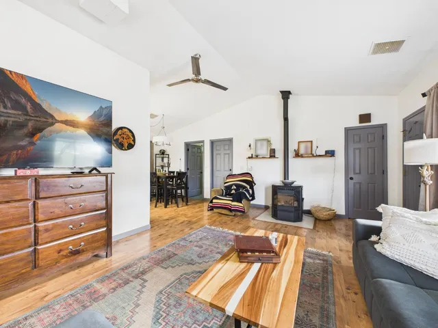 a bedroom with furniture and a mirror