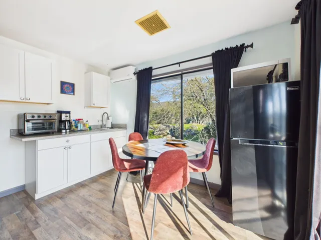 a kitchen with a stove a sink and a refrigerator