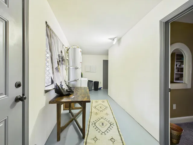 a living room with furniture and a ceiling fan