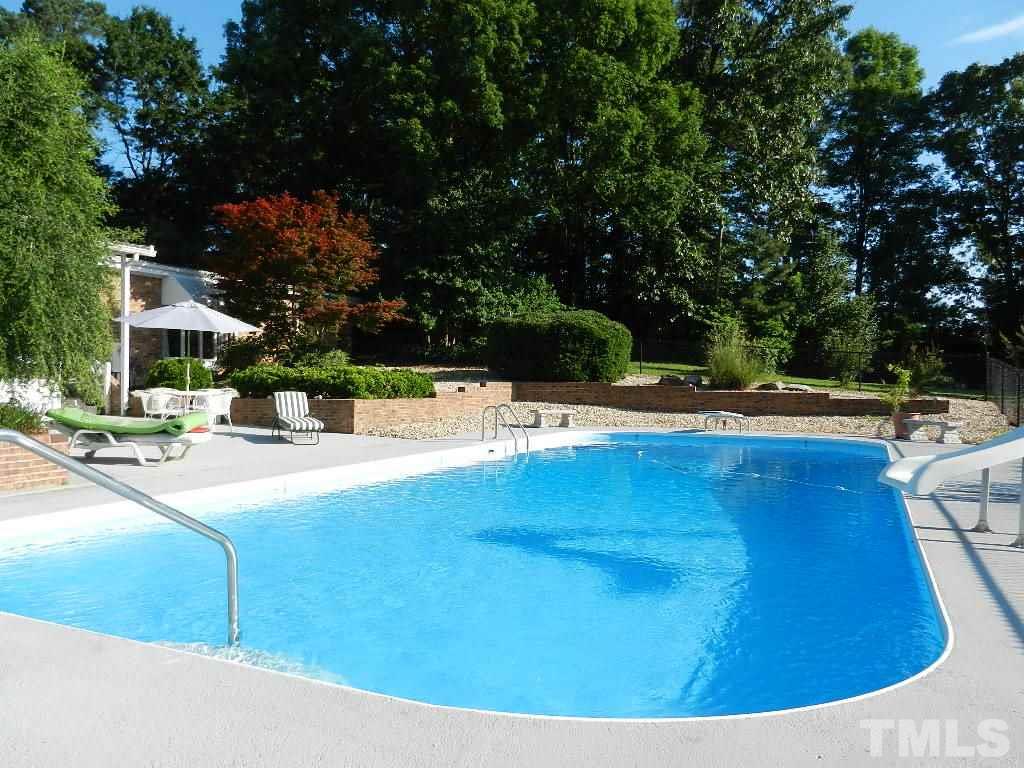 4424 Mitchell Mill Road Wake Forest, NC 27587 - Photo 5 of 25 a view of a swimming pool with a patio