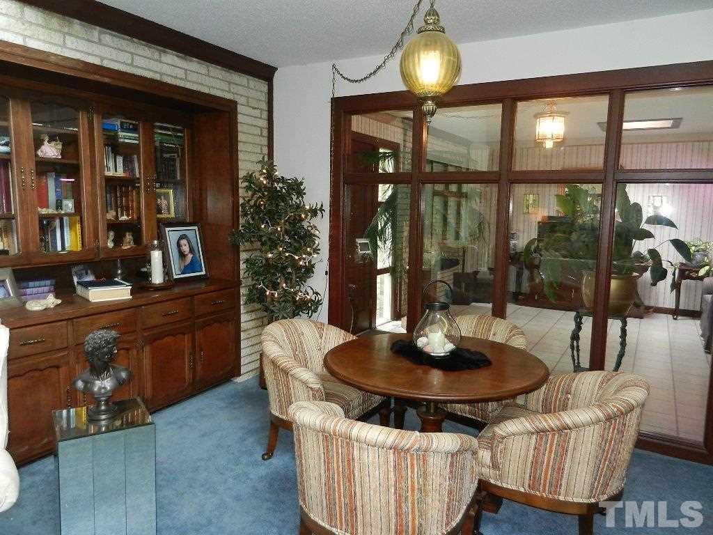 4424 Mitchell Mill Road Wake Forest, NC 27587 - Photo 8 of 25 a table and chairs in a living room
