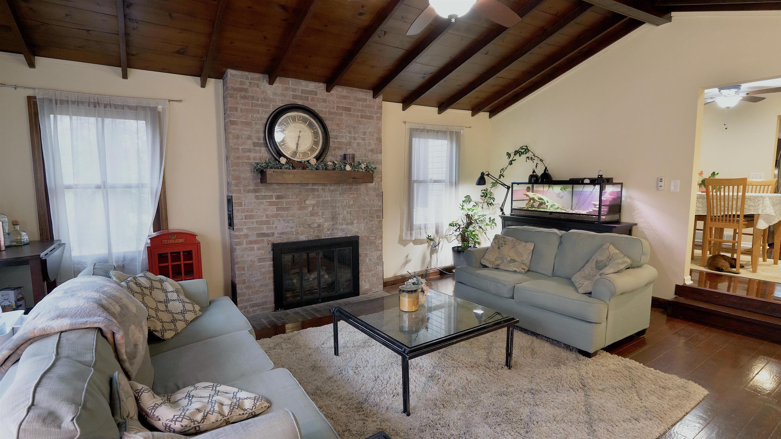 4626 Spring Creek Road Rockford, IL 61114 - Photo 13 of 31 a living room with furniture and a fireplace