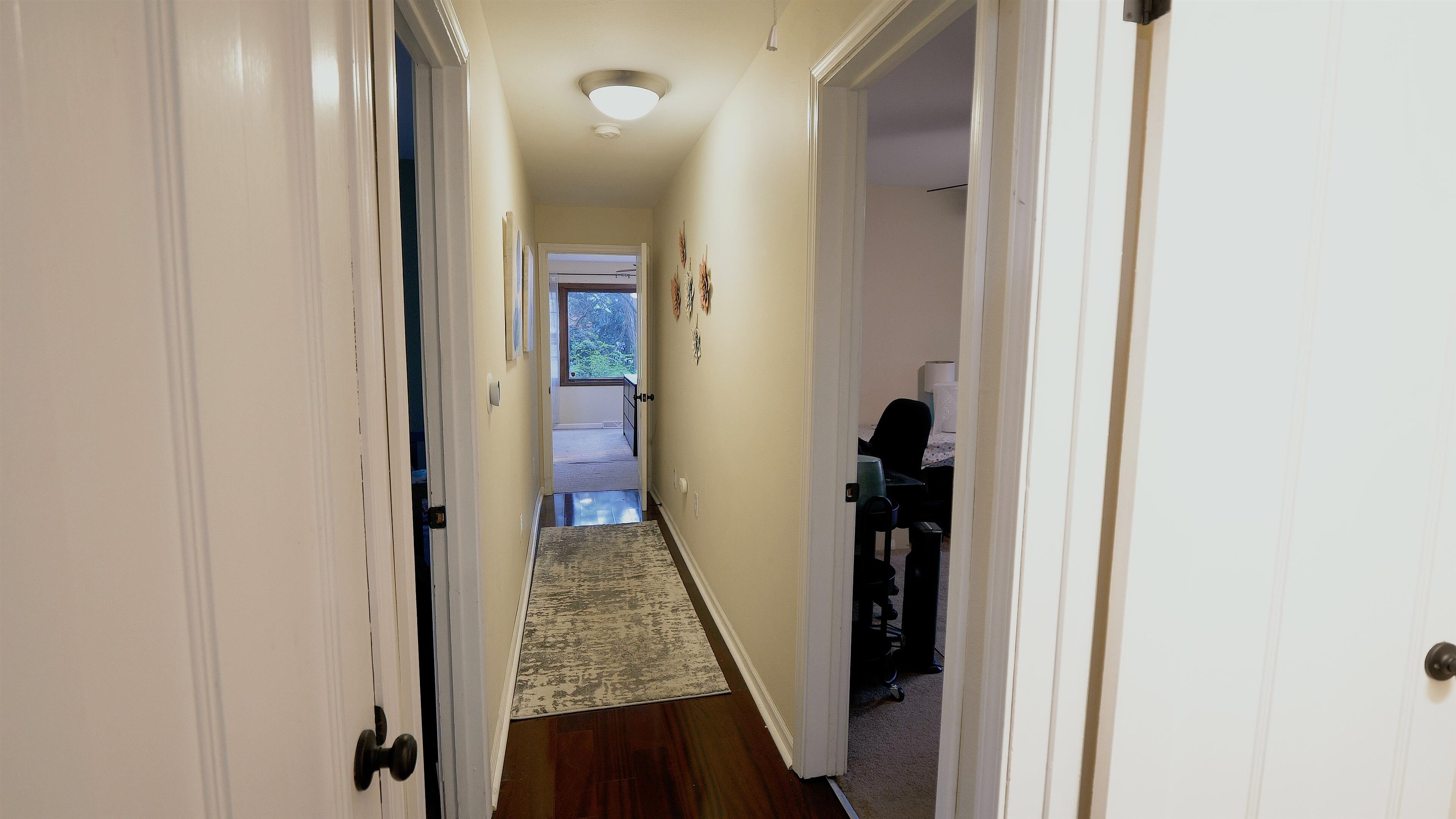 4626 Spring Creek Road Rockford, IL 61114 - Photo 16 of 31 a view of a hallway with wooden floor and stairs
