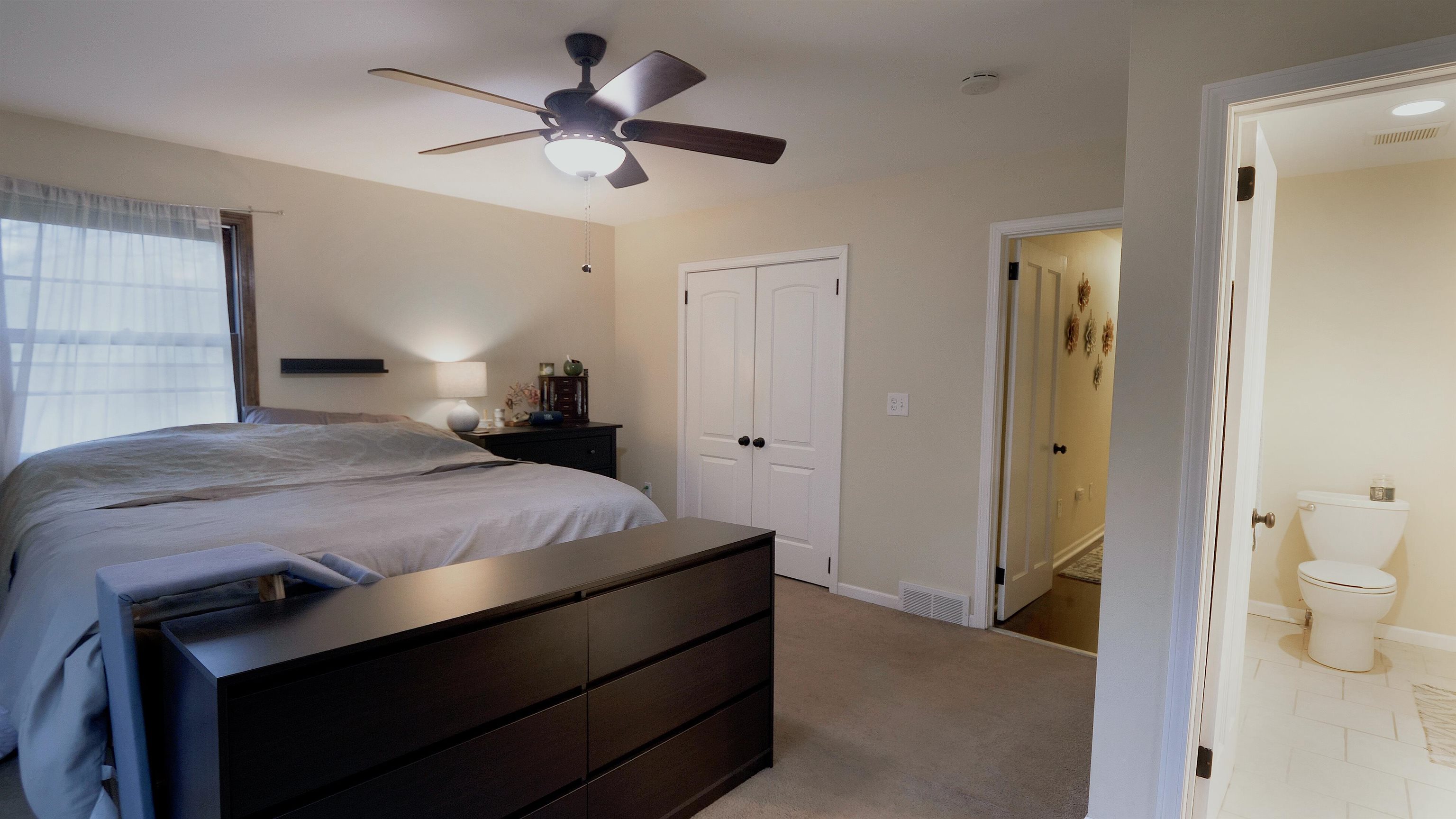 4626 Spring Creek Road Rockford, IL 61114 - Photo 17 of 31 a bedroom with a bed and a bathroom