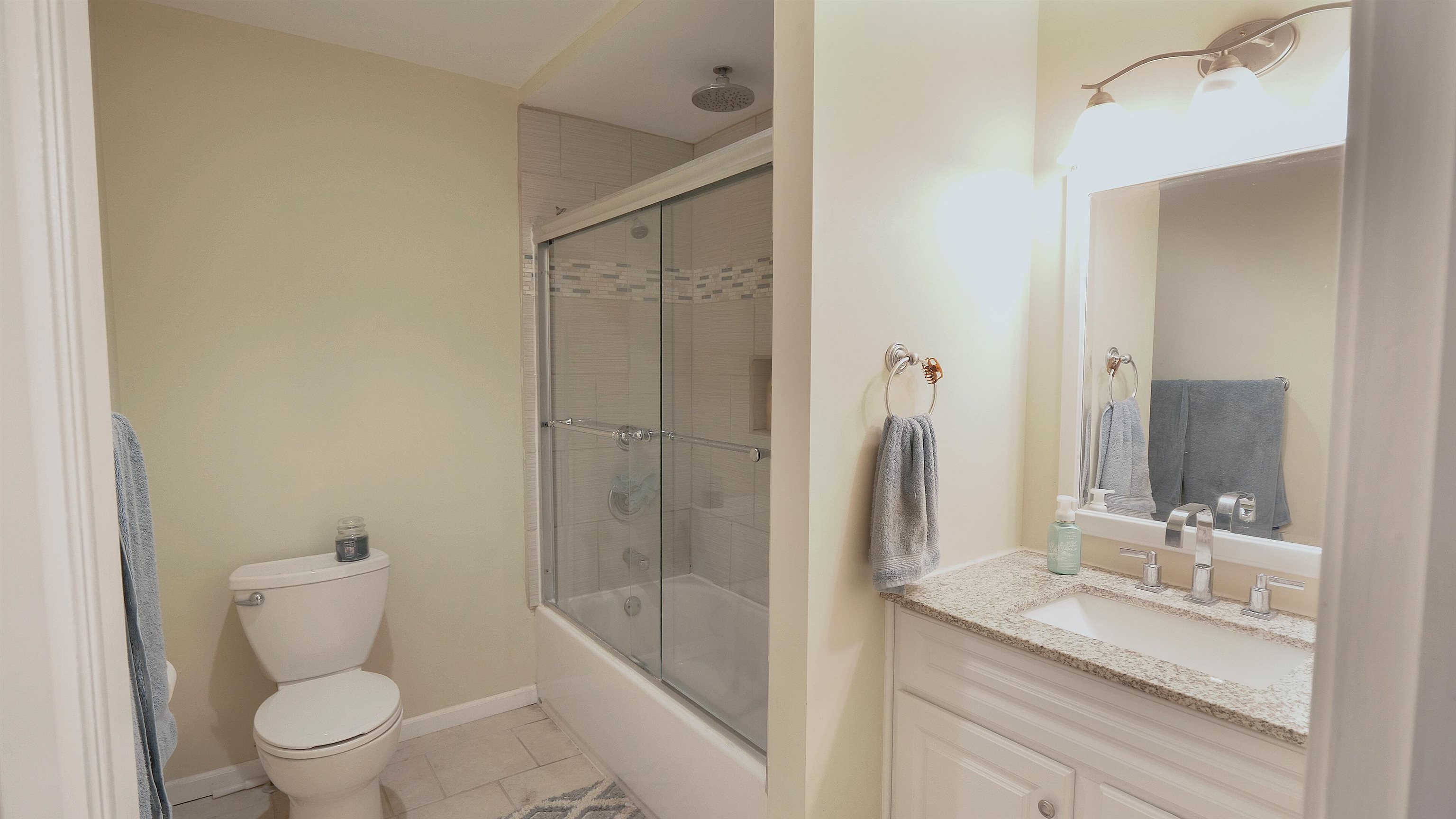4626 Spring Creek Road Rockford, IL 61114 - Photo 18 of 31 a bathroom with a granite countertop sink toilet and shower