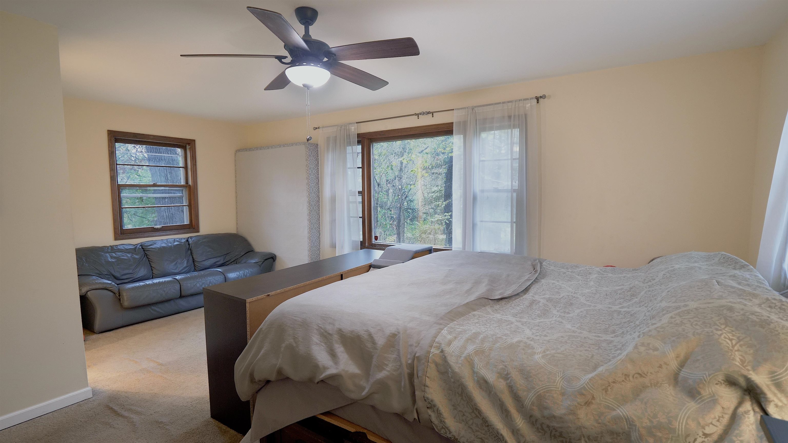 4626 Spring Creek Road Rockford, IL 61114 - Photo 20 of 31 a bedroom with a bed couch and window