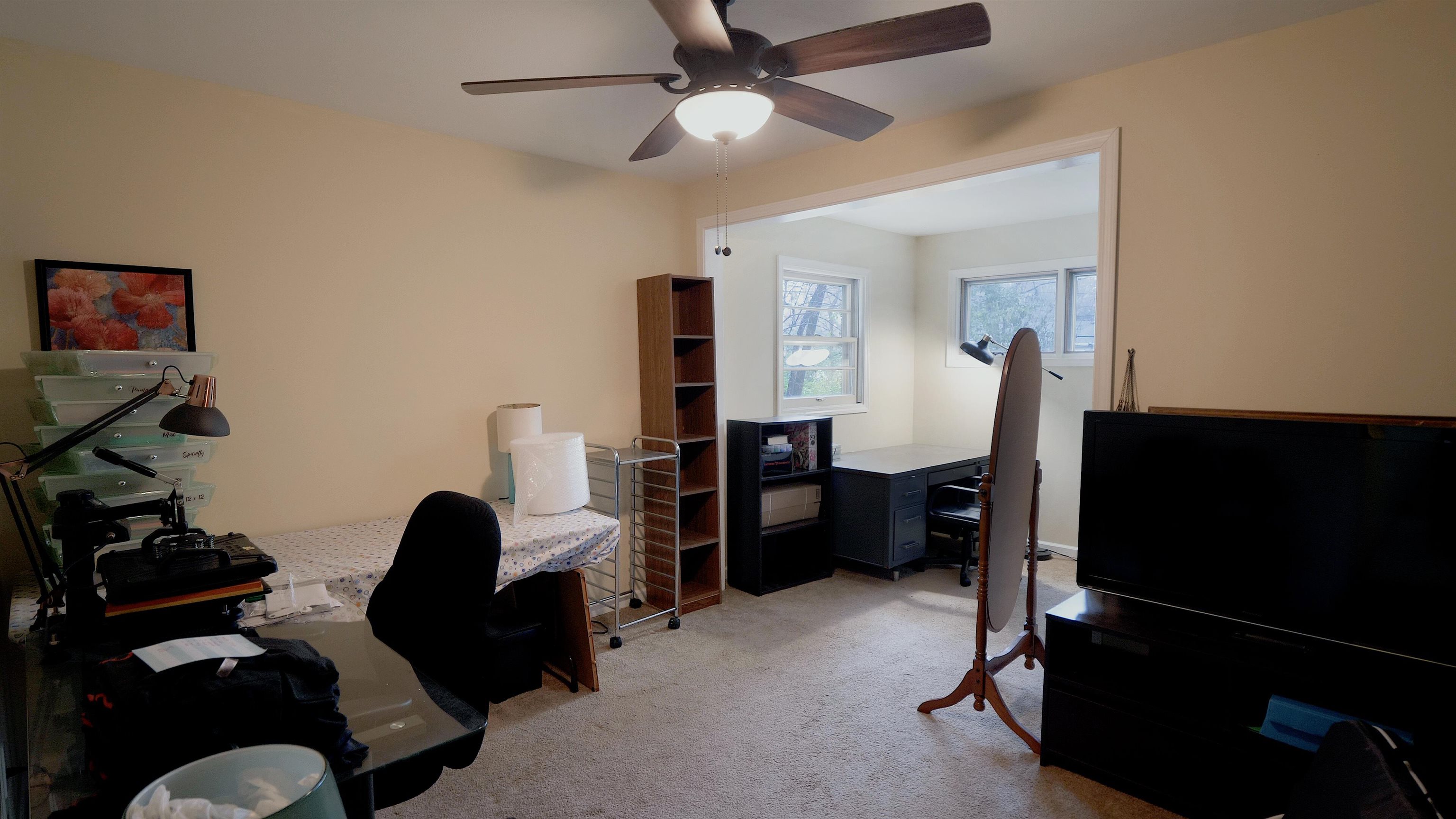 4626 Spring Creek Road Rockford, IL 61114 - Photo 23 of 31 a living room with furniture and a flat screen tv
