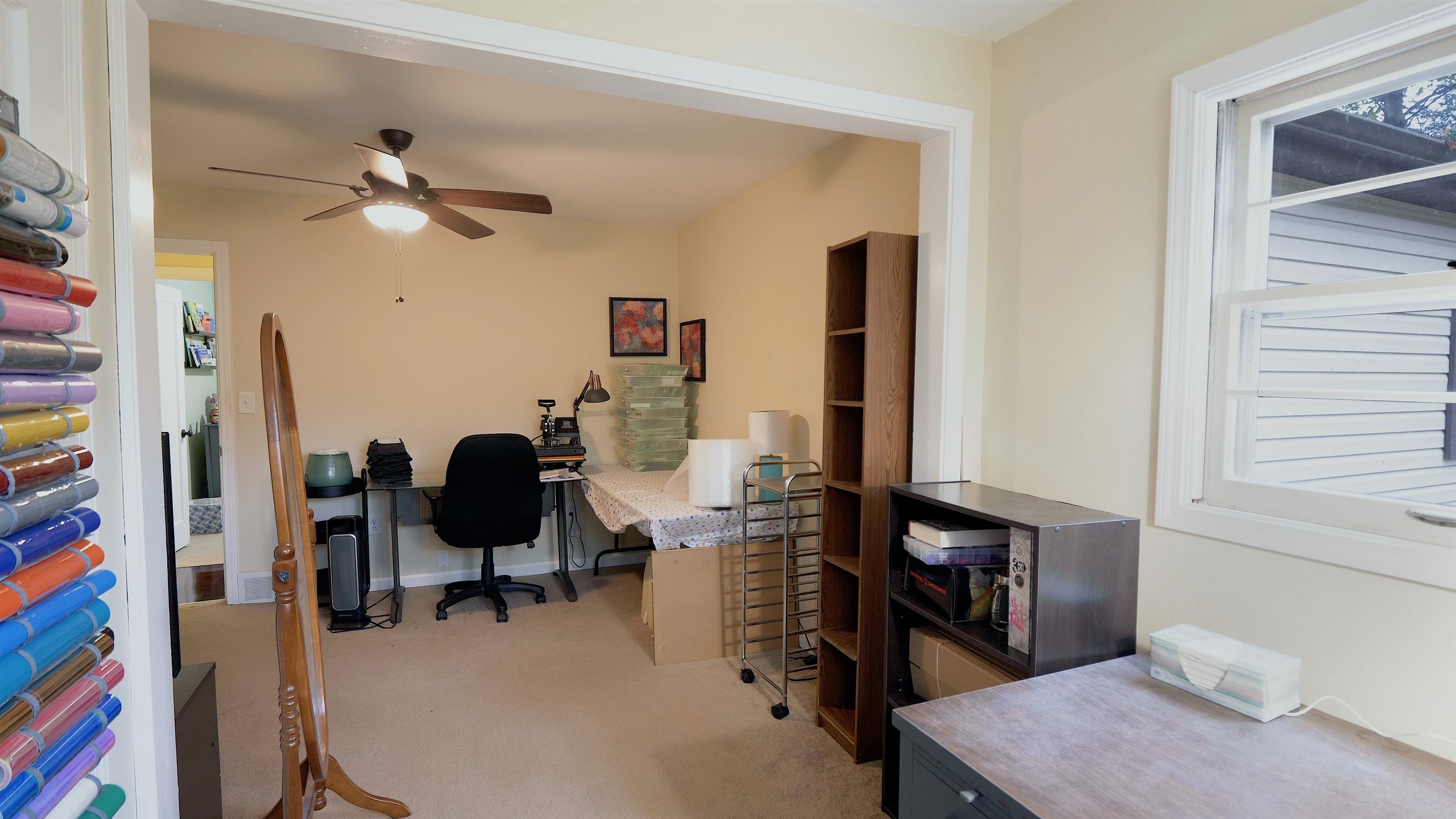 4626 Spring Creek Road Rockford, IL 61114 - Photo 24 of 31 a view of a workspace with furniture and a window