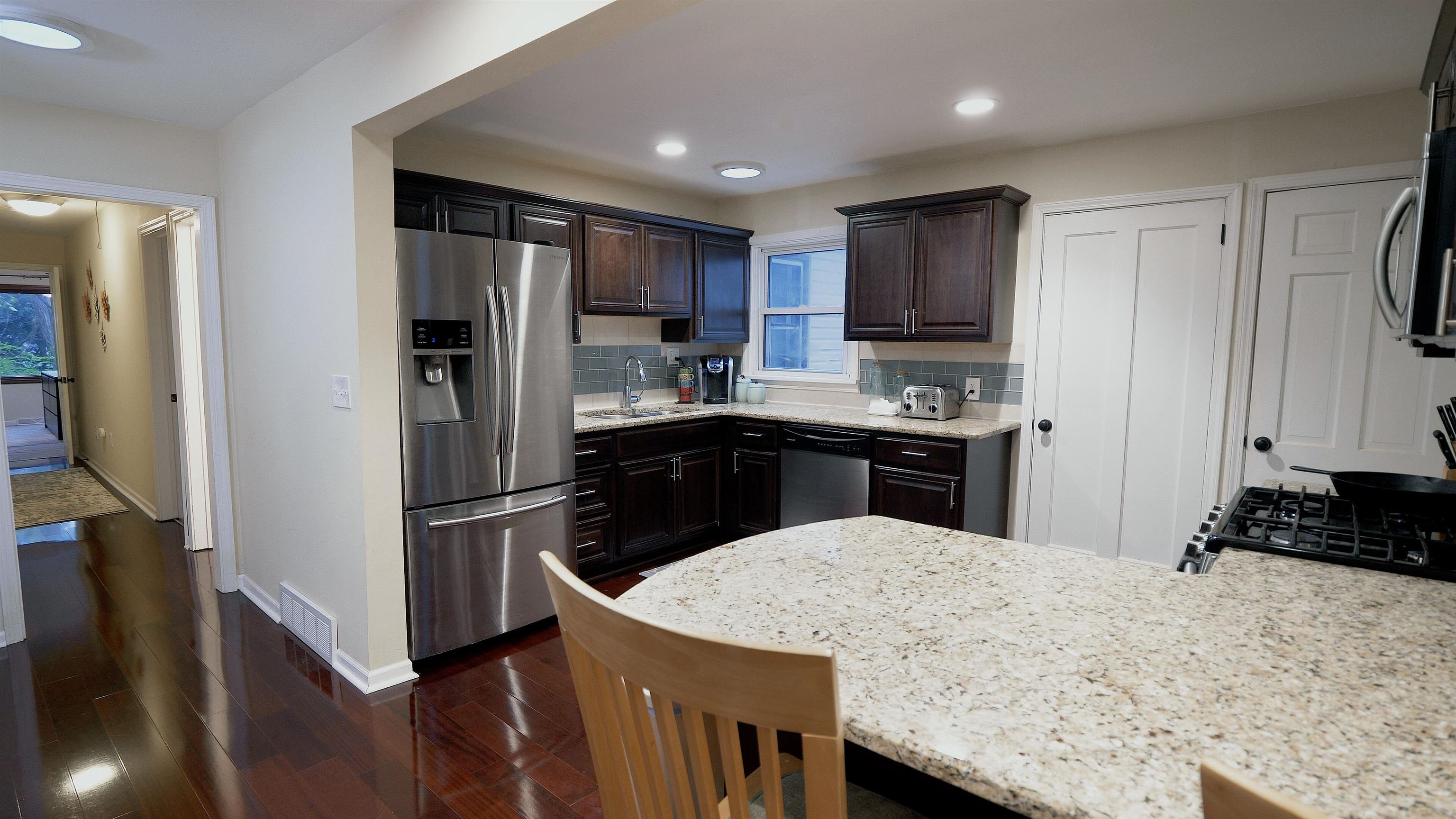 4626 Spring Creek Road Rockford, IL 61114 - Photo 6 of 31 a kitchen with kitchen island a sink stainless steel appliances and cabinets