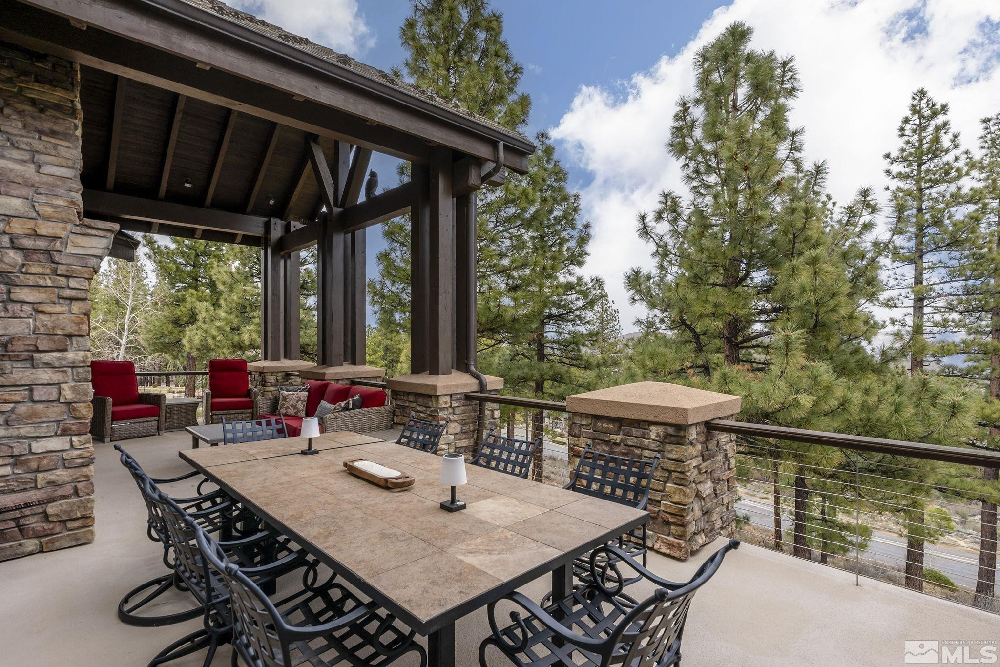 4660 West Pinewild Road Reno, NV 89511 - Photo 12 of 40 a view of a patio with a table chairs and a table
