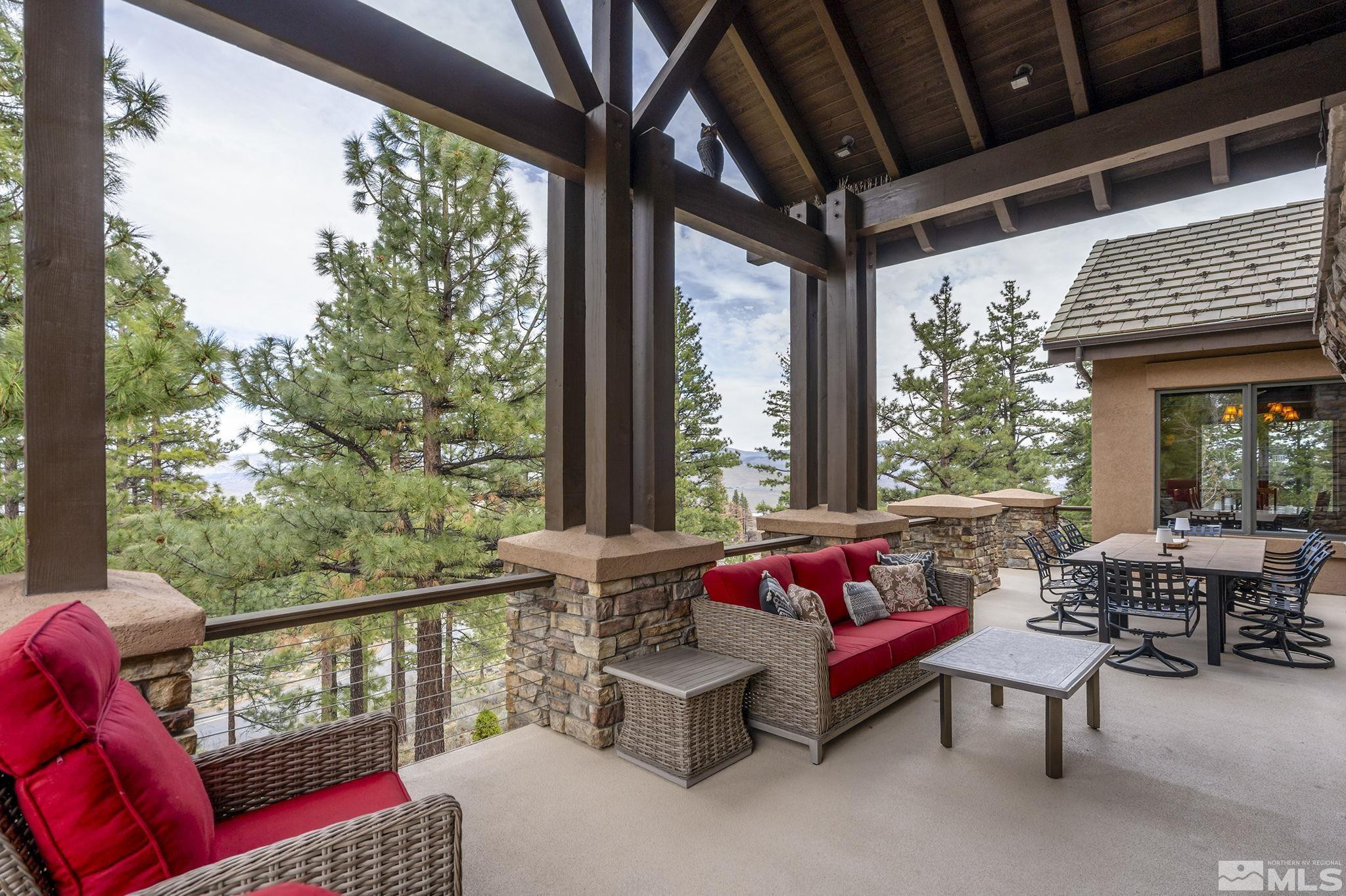 4660 West Pinewild Road Reno, NV 89511 - Photo 13 of 40 a balcony with furniture and a potted plant