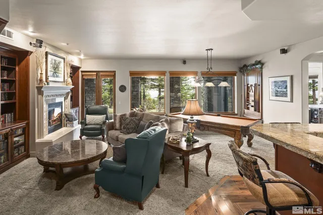 a room with a table chairs and a wooden floor