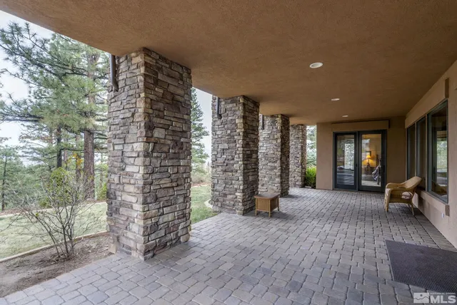 a outdoor space with patio couch and wooden floor