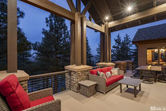 a outdoor dining space with furniture and city view