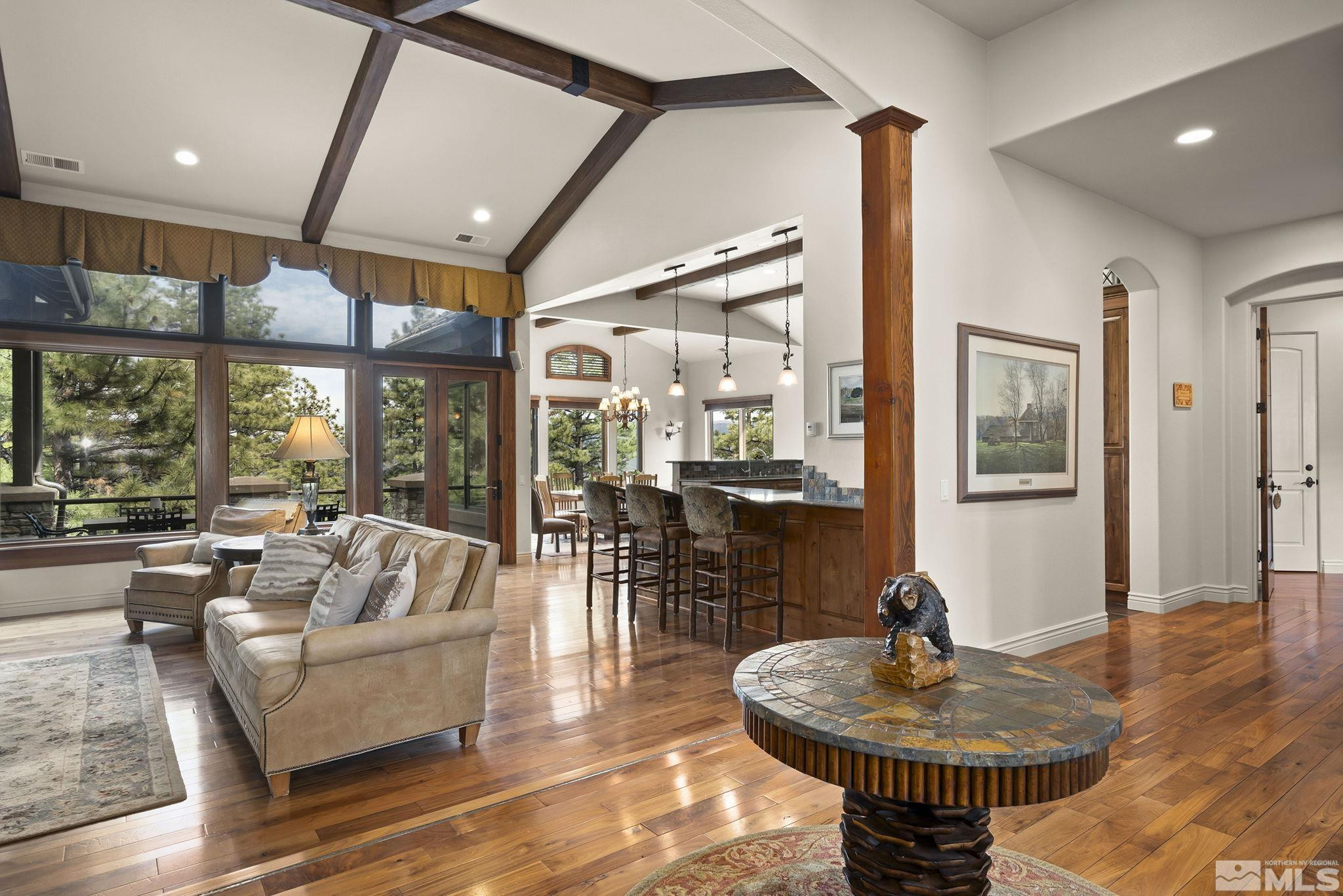 4660 West Pinewild Road Reno, NV 89511 - Photo 5 of 40 a living room with patio furniture and a wooden floor