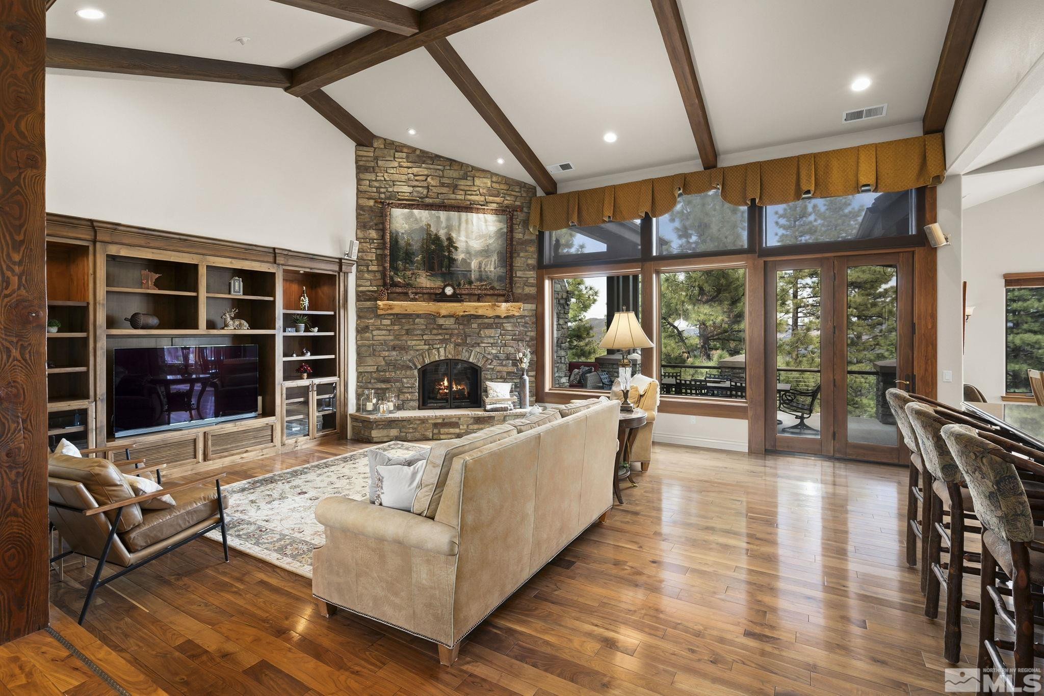 4660 West Pinewild Road Reno, NV 89511 - Photo 6 of 40 a living room with furniture and a fireplace