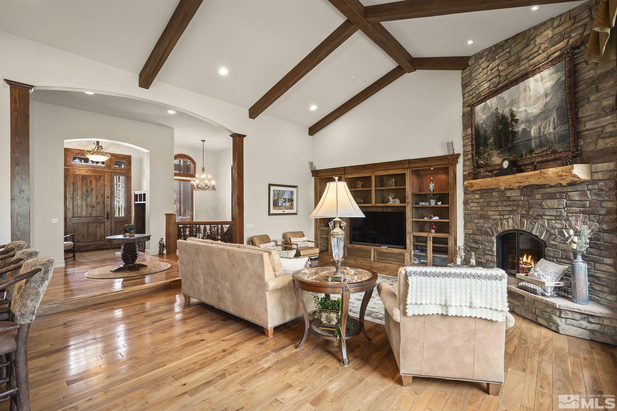 4660 West Pinewild Road Reno, NV 89511 - Photo 8 of 40 a living room with fireplace furniture and a floor to ceiling window
