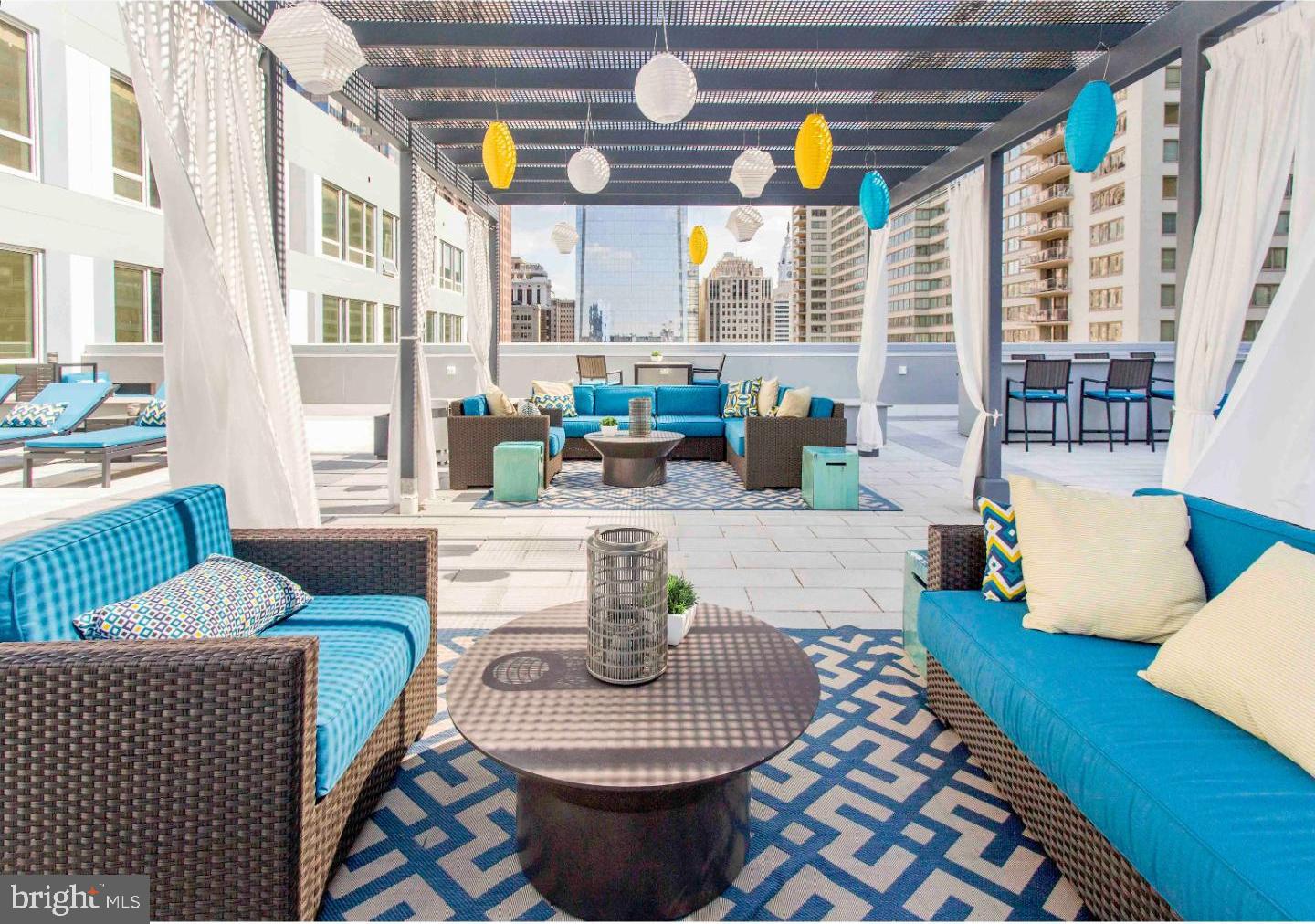 1900-20 Arch Street, Unit 109 Philadelphia, PA 19103 - Photo 17 of 34 a living room with furniture and a large window