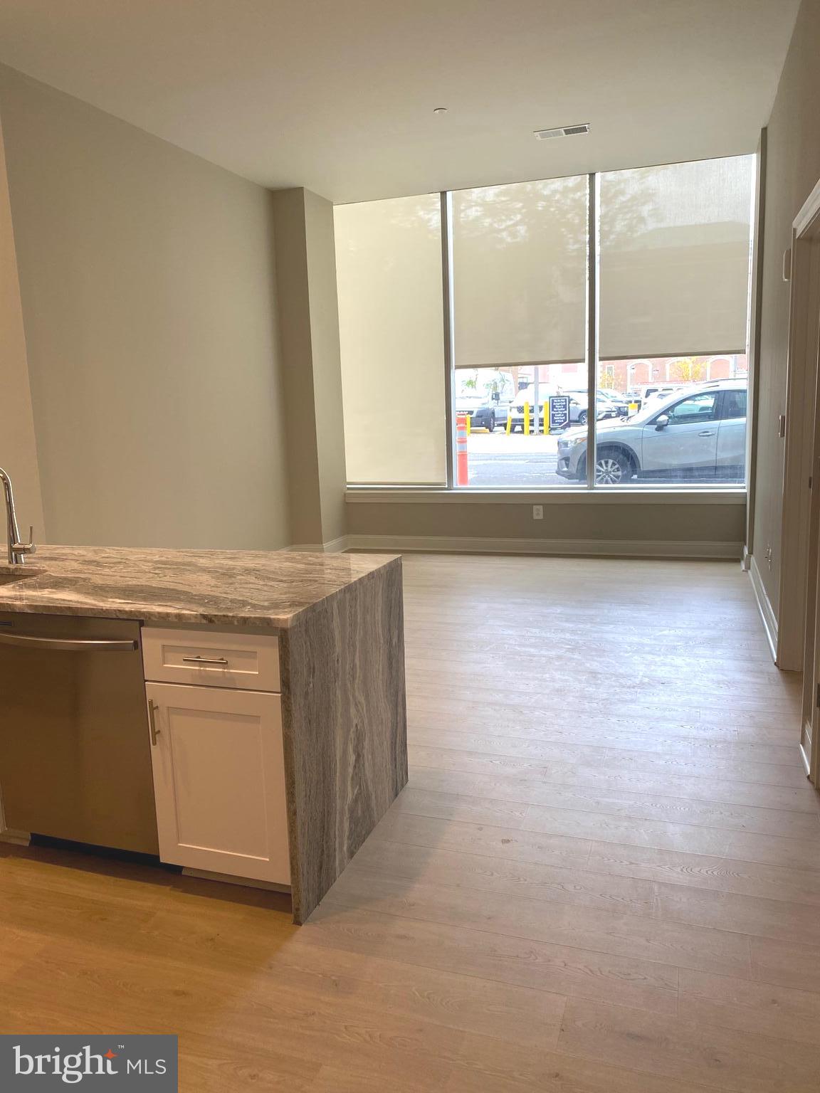 1900-20 Arch Street, Unit 109 Philadelphia, PA 19103 - Photo 3 of 34 a view of an empty room with a window