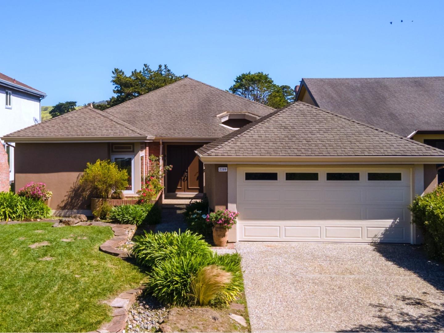 2309 Burning Tree Road Half Moon Bay, CA 94019 - Photo 1 of 36 a front view of a house with garden