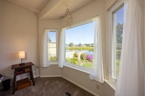 a room with furniture and a window