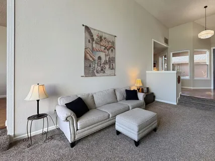 a living room with furniture and a window