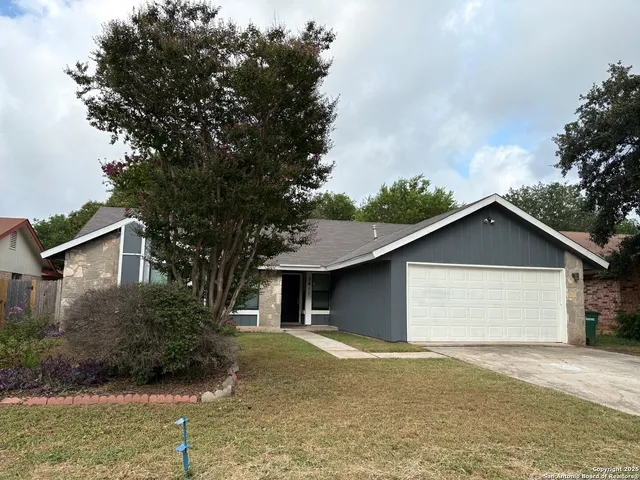 a view of outdoor space of a house with garage