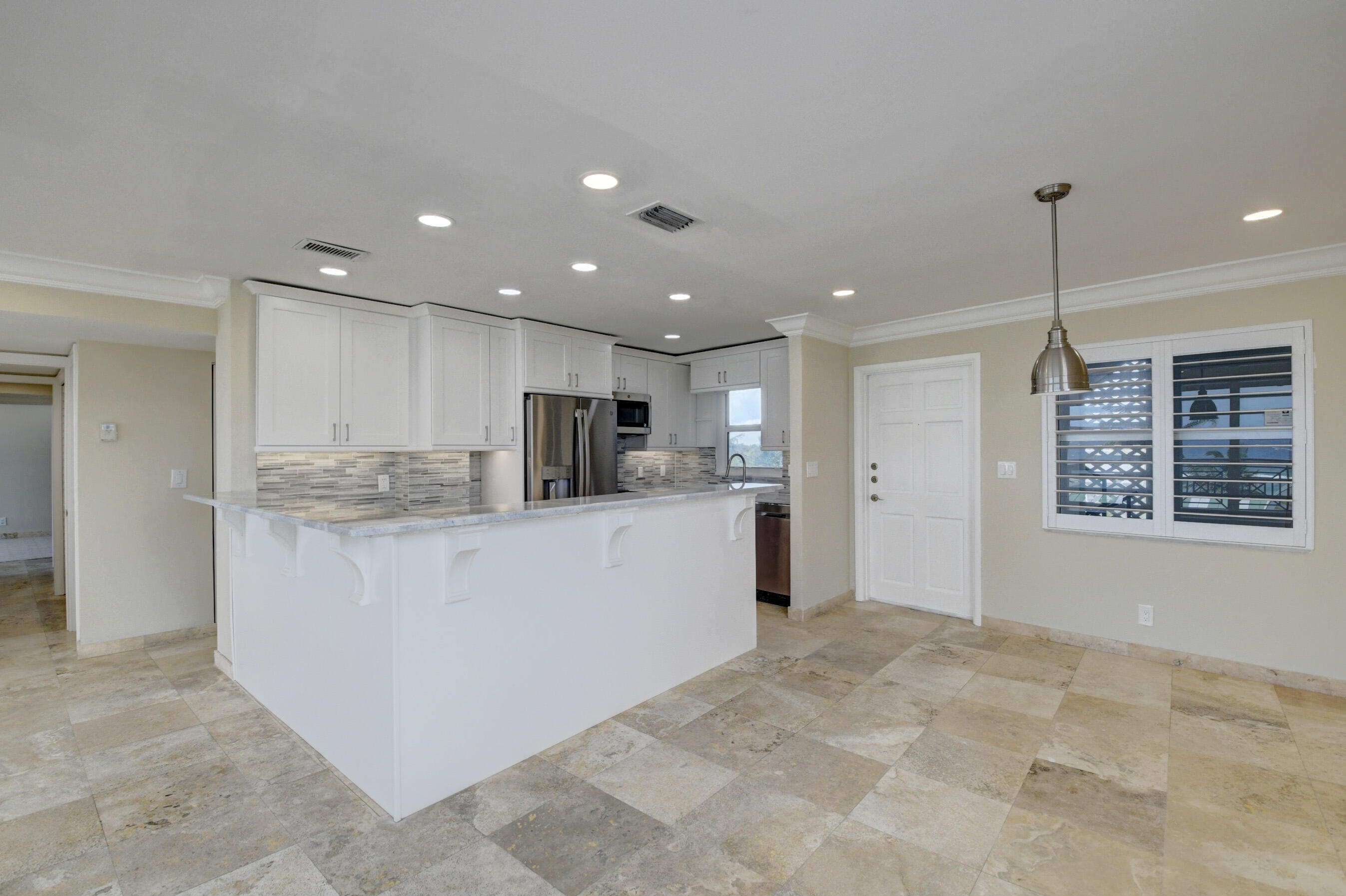 36 South Ocean Boulevard, Unit B3 Delray Beach, FL 33483 - Photo 13 of 47 a view of kitchen with stainless steel appliances kitchen island granite countertop a refrigerator and a sink