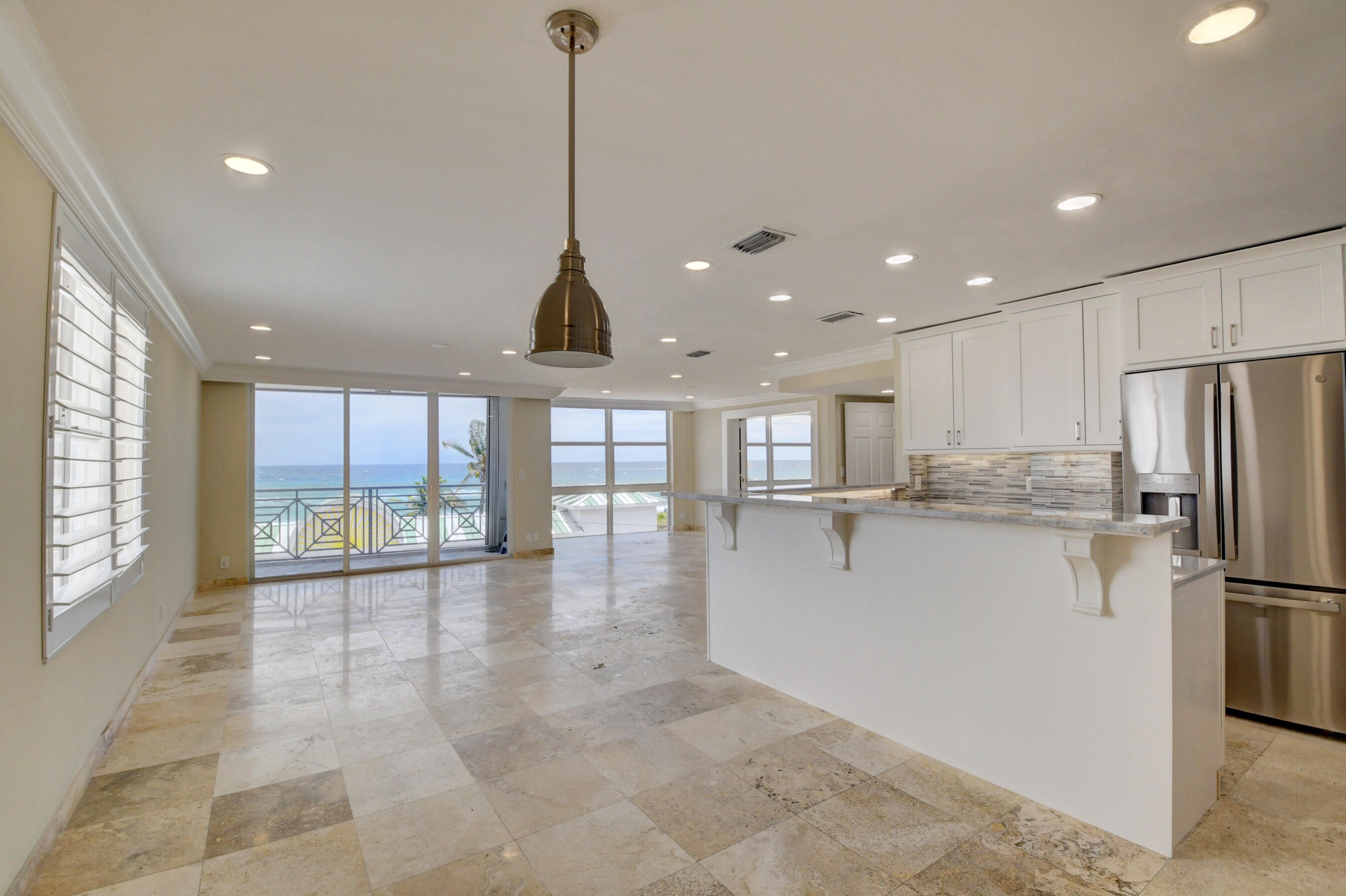 36 South Ocean Boulevard, Unit B3 Delray Beach, FL 33483 - Photo 20 of 47 a view of a kitchen with refrigerator and windows