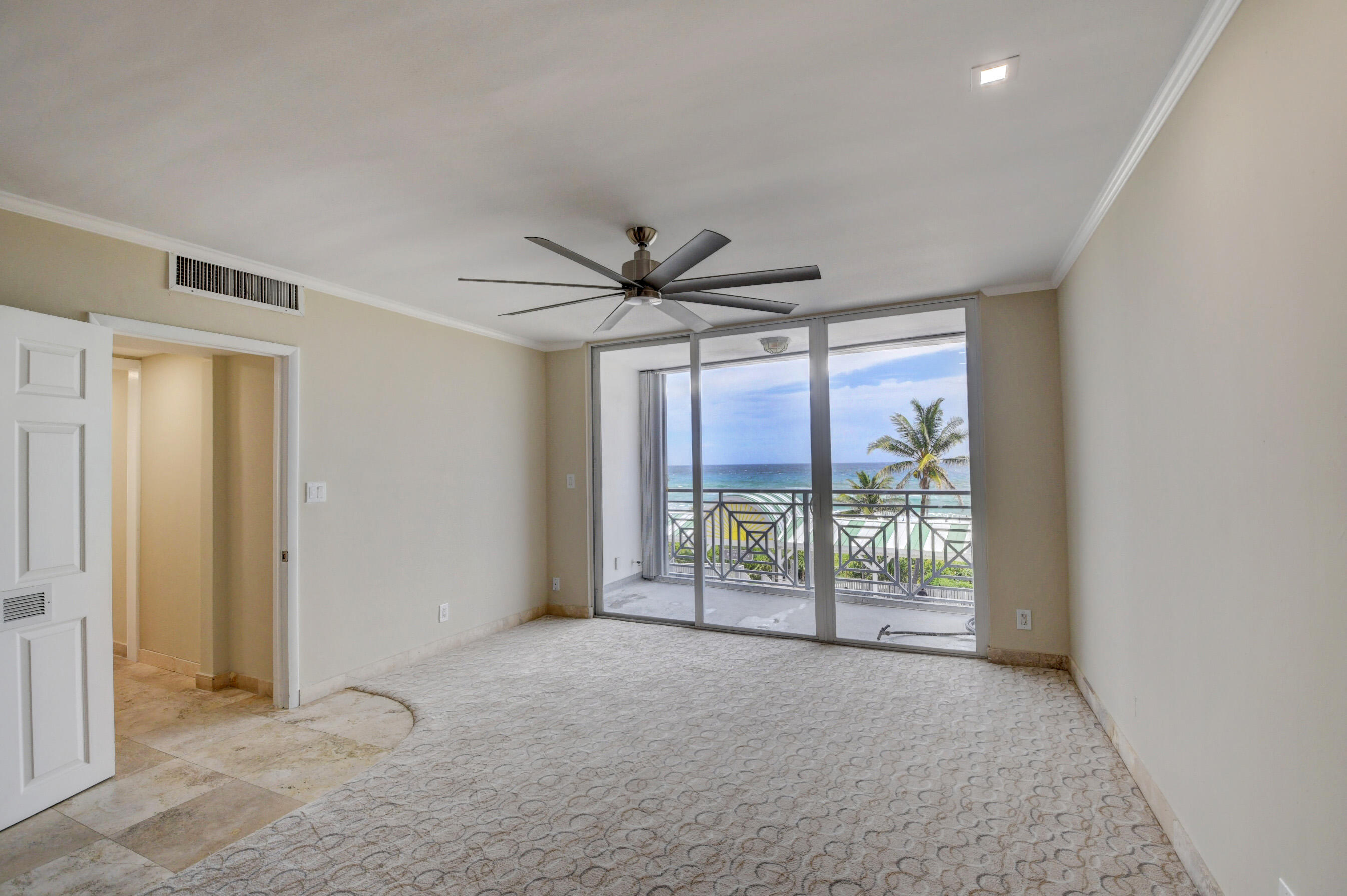 36 South Ocean Boulevard, Unit B3 Delray Beach, FL 33483 - Photo 36 of 47 a view of a livingroom with a ceiling fan and window