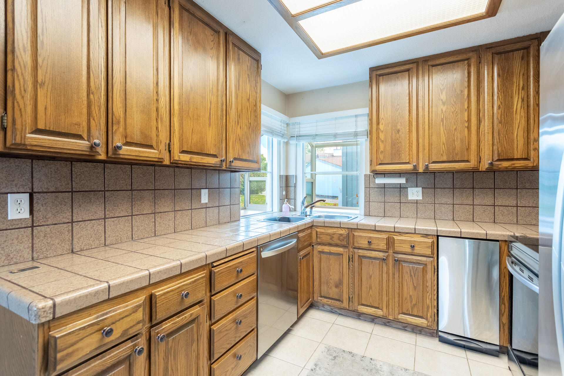 466 Ridgecrest Trail, Unit 136 Redding, CA 96003 - Photo 3 of 16 a kitchen with a sink cabinets and window
