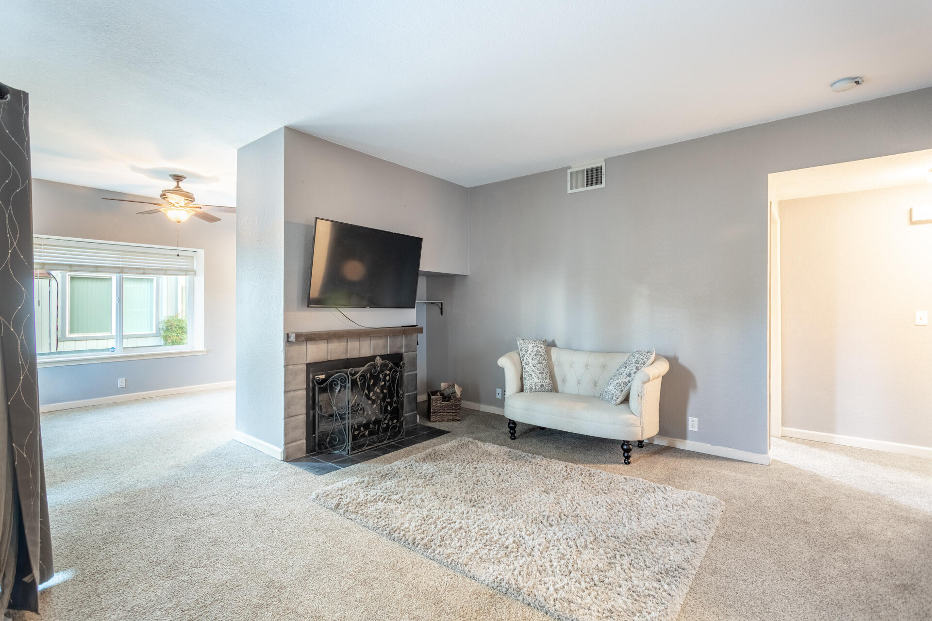466 Ridgecrest Trail, Unit 136 Redding, CA 96003 - Photo 6 of 16 a living room with furniture and a fireplace