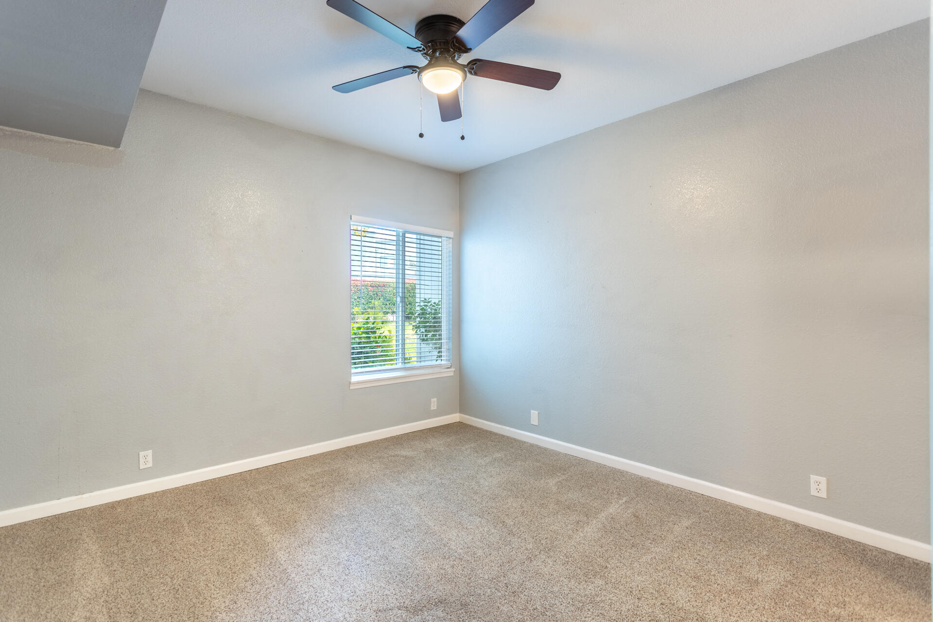 466 Ridgecrest Trail, Unit 136 Redding, CA 96003 - Photo 8 of 16 an empty room with a window and a fan