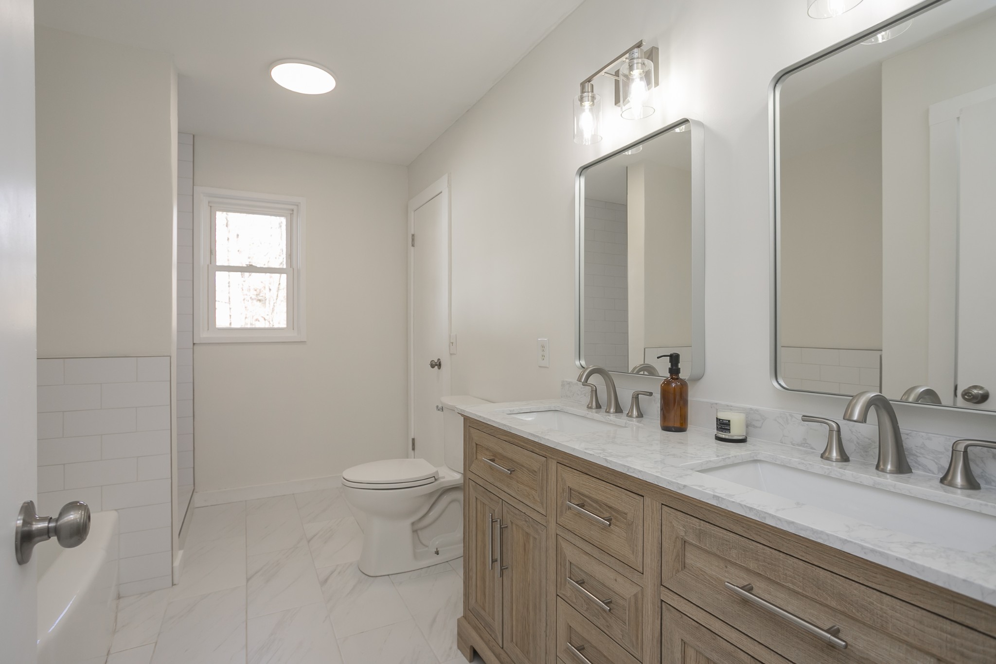 7439 Highway 49 Springfield, TN 37172 - Photo 8 of 19 a bathroom with a double vanity sink toilet and a mirror
