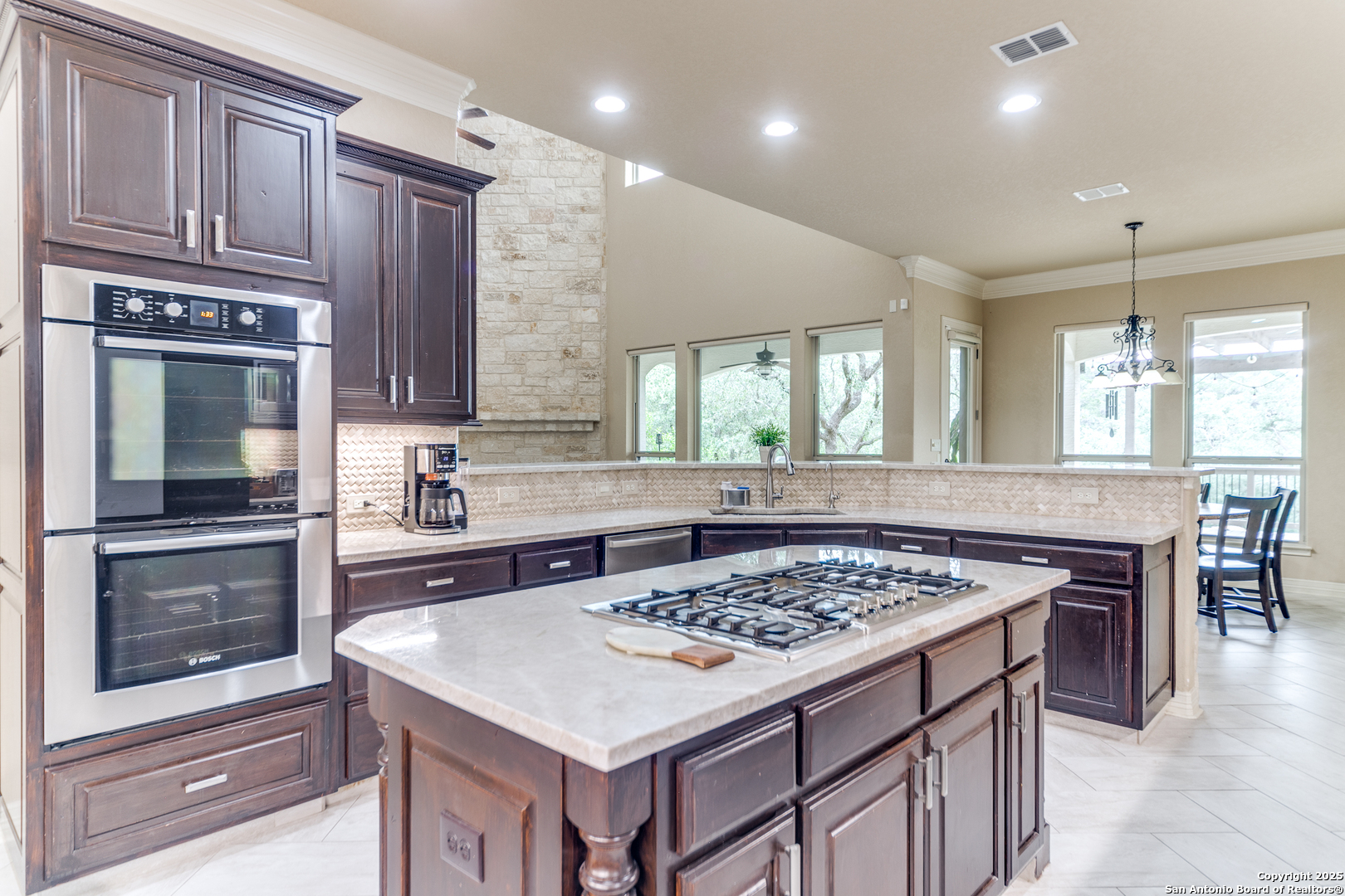 714 Ruidosa Downs Helotes, TX 78023 - Photo 11 of 42 a kitchen with a stove a sink and a refrigerator