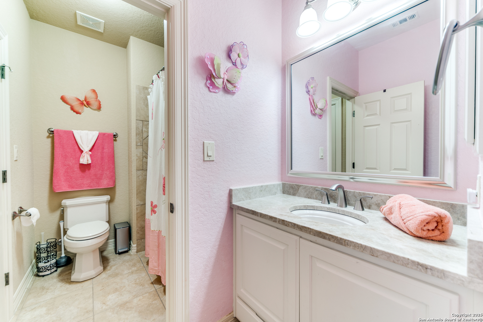 714 Ruidosa Downs Helotes, TX 78023 - Photo 21 of 42 a bathroom with a sink and a mirror