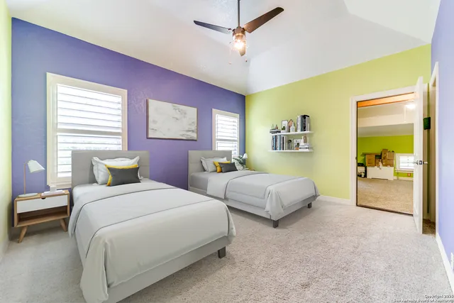 a bedroom with a bed and a couch