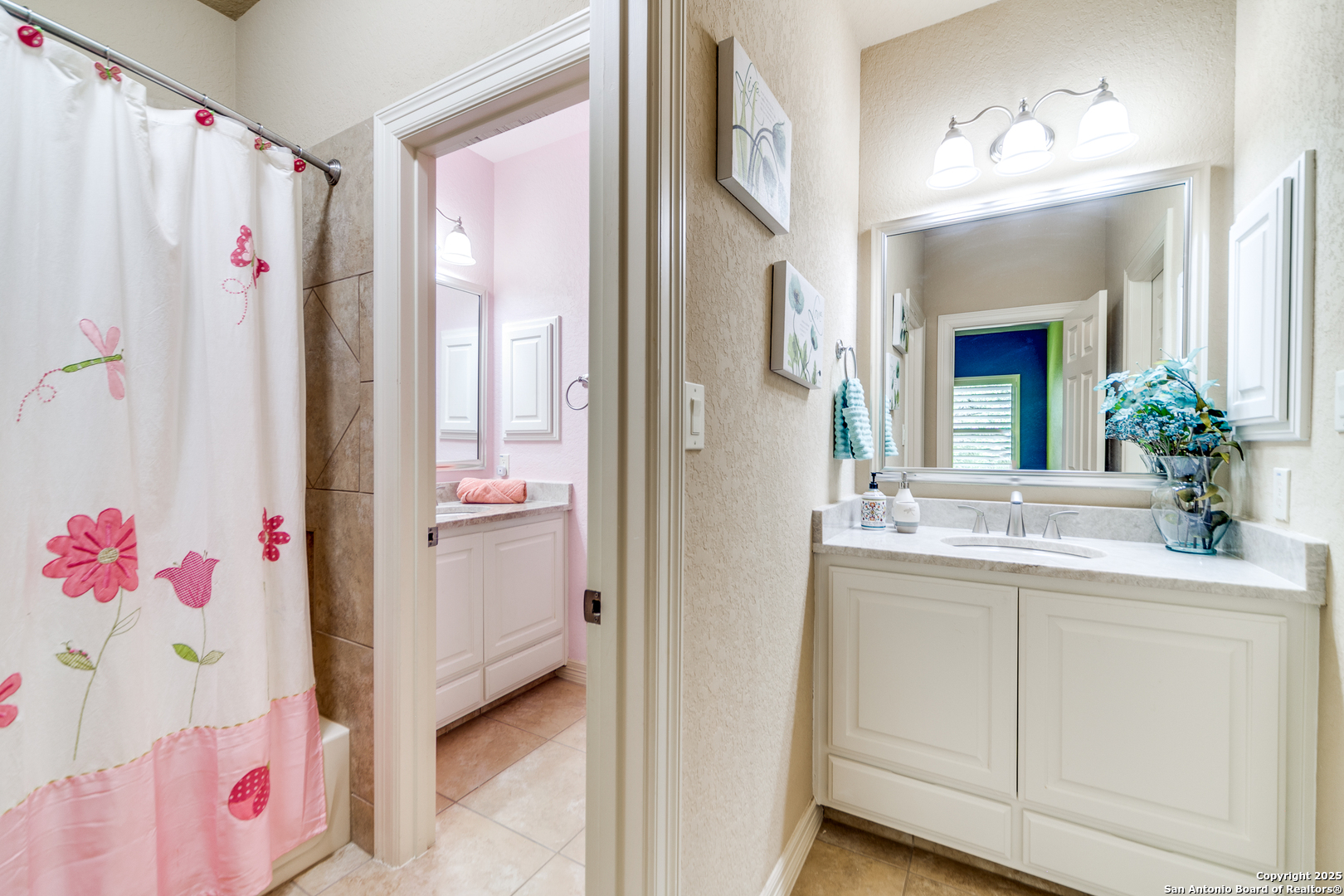 714 Ruidosa Downs Helotes, TX 78023 - Photo 24 of 42 a bathroom with a sink vanity and a mirror