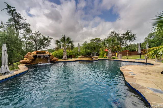 a view of a swimming pool with a patio