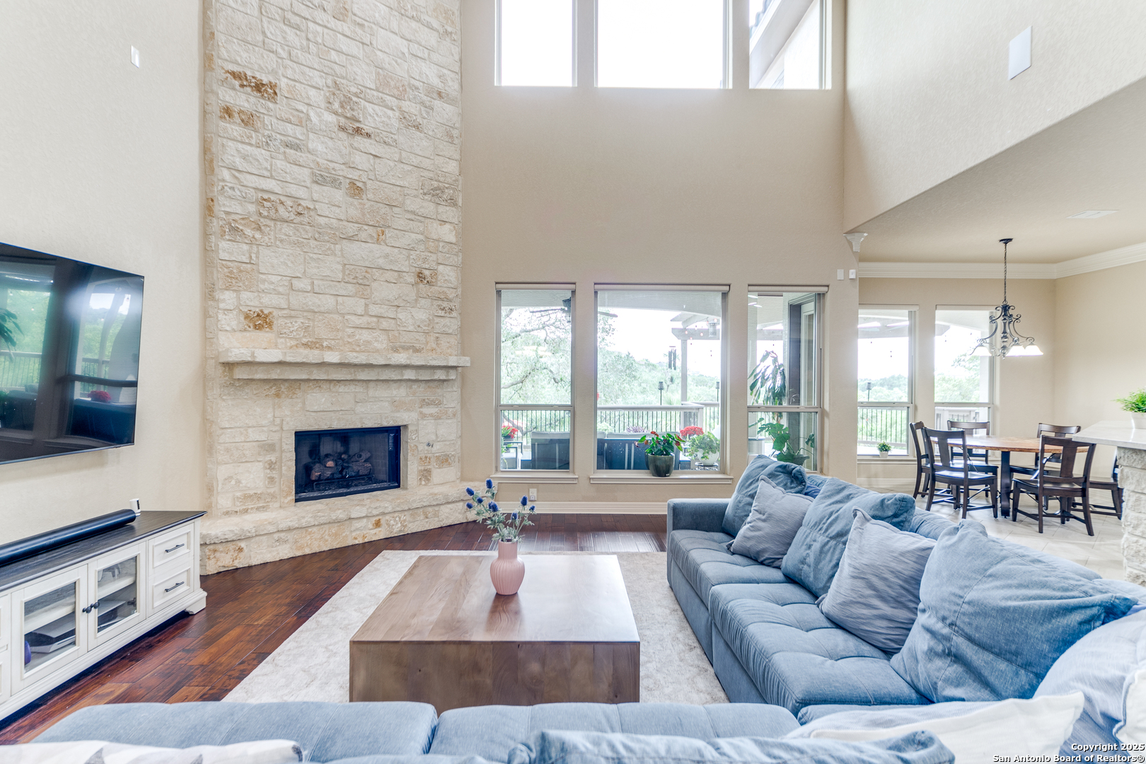 714 Ruidosa Downs Helotes, TX 78023 - Photo 7 of 42 a living room with furniture large window and a fireplace