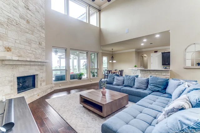 a living room with furniture and a fireplace