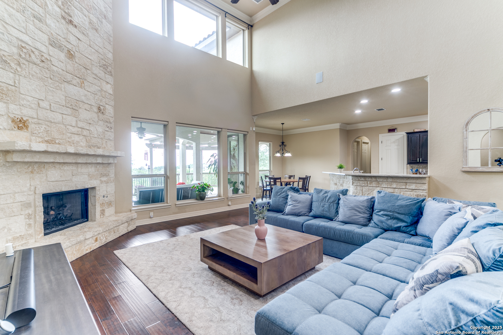 714 Ruidosa Downs Helotes, TX 78023 - Photo 8 of 42 a living room with furniture and a fireplace