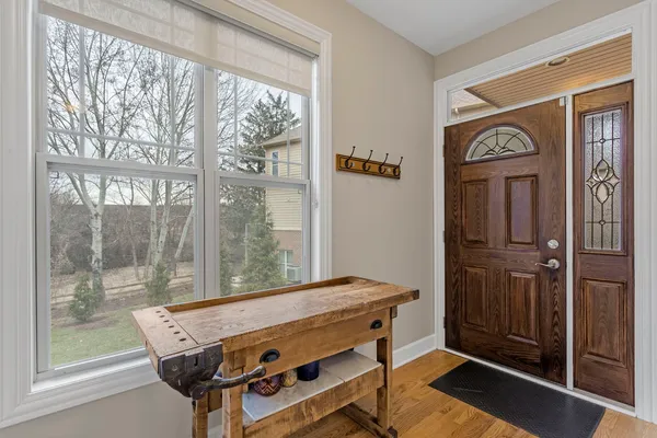 a living room with furniture fireplace and window