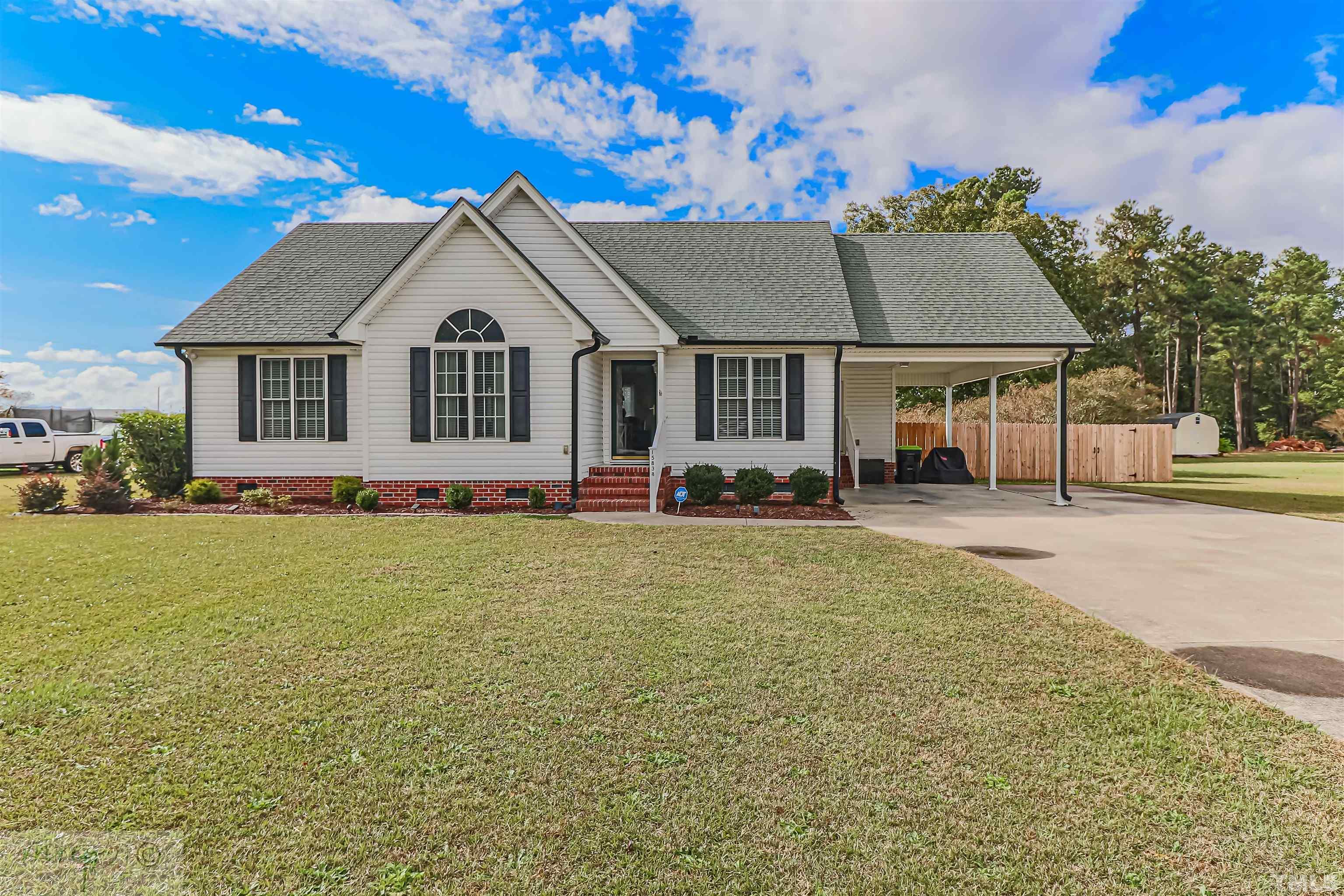 15838 Old Smithfield Road Sims, NC 27880 - Photo 1 of 27 a front view of a house with a yard and garage