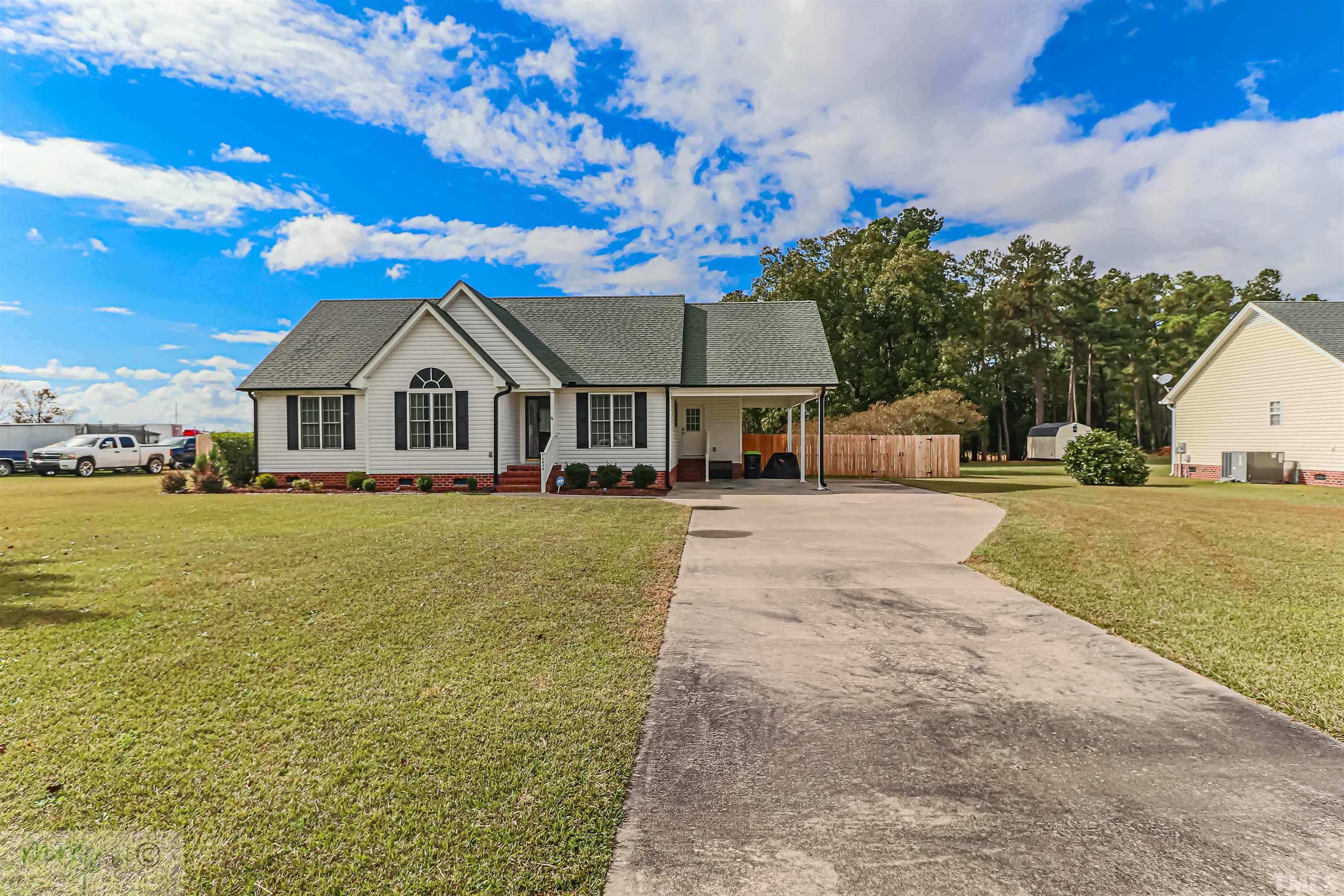 15838 Old Smithfield Road Sims, NC 27880 - Photo 2 of 27 a front view of a house with a yard and trees