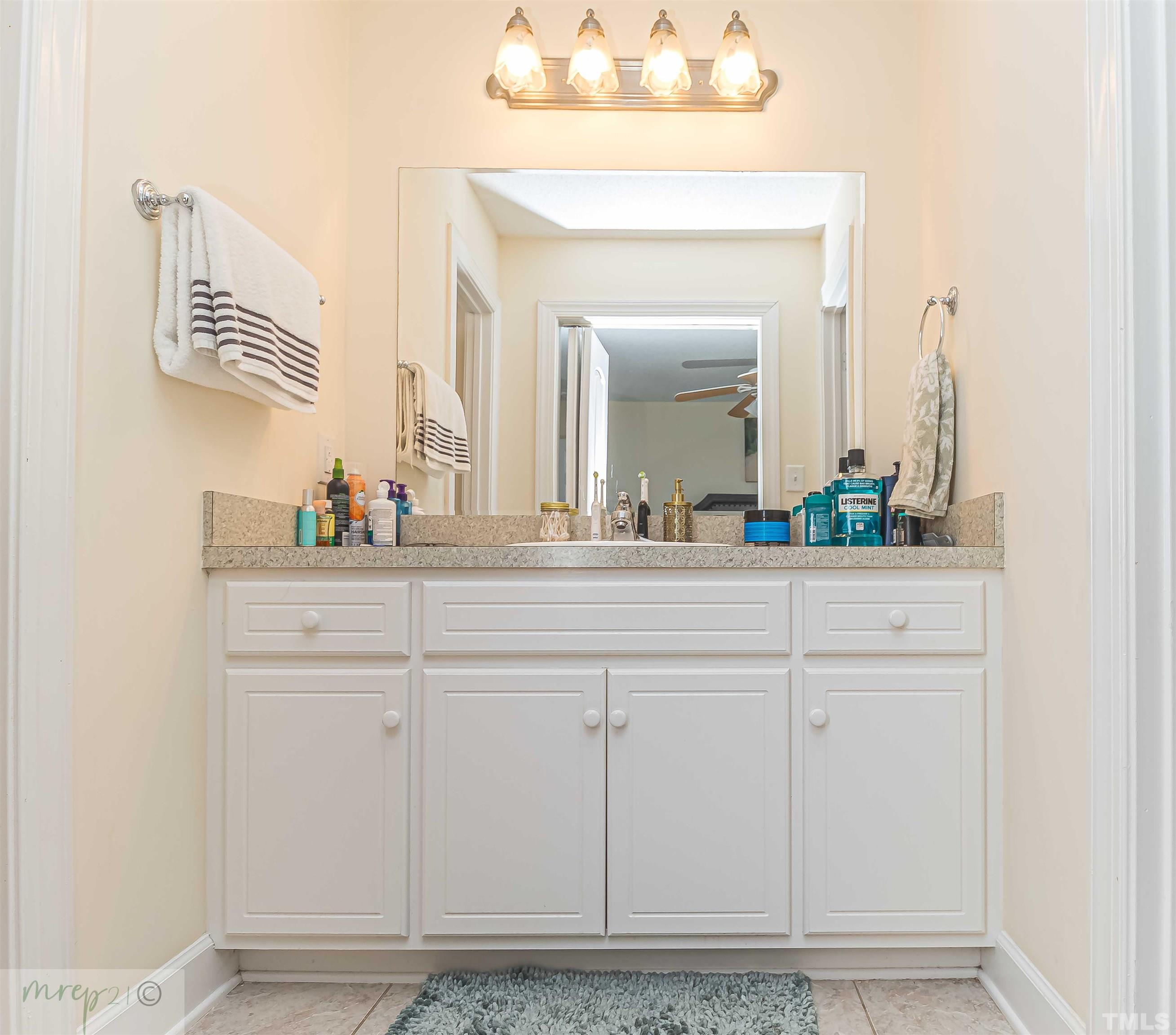 15838 Old Smithfield Road Sims, NC 27880 - Photo 18 of 27 a bathroom with a sink vanity and mirror